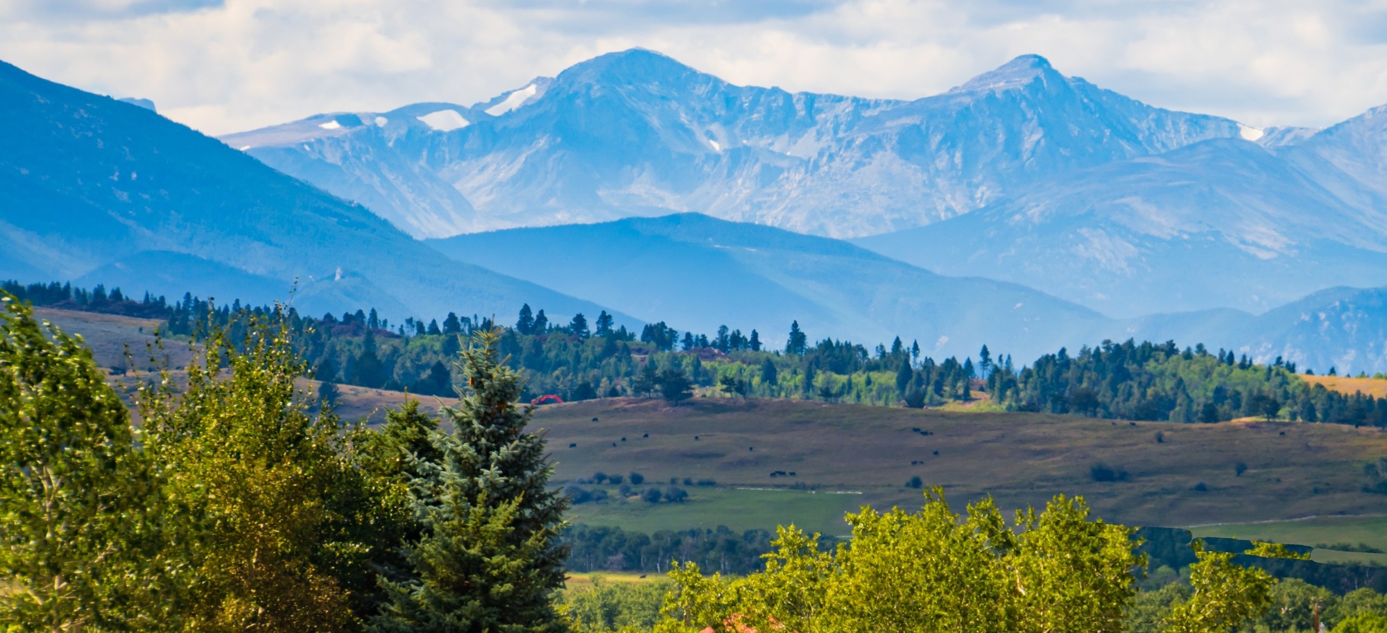 Mountain peaks above a green valley